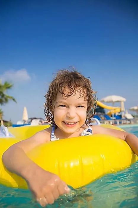 Framed Print : Happy child playing in swimming pool. Summer vacations concept