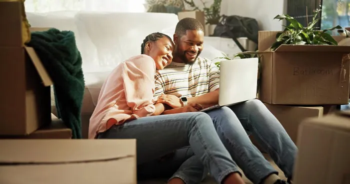 Framed Print : Happy, couple and browsing on laptop in new home Framed Print : Happy, couple and browsing on laptop in new home