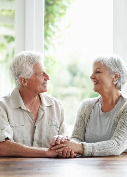 Framed Print : Happy senior couple holding hands in support Framed Print : Happy senior couple holding hands in support
