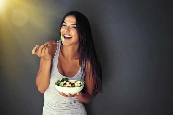 Framed Print : Happy woman is eating a salad, healthy food and nutrition