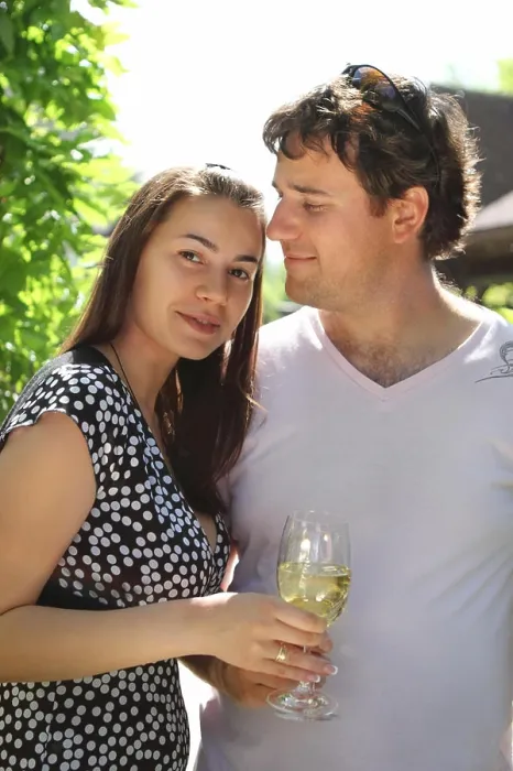 Framed Print : Happy woman and man holding glasses of white wine making a toast Framed Print : Happy woman and man holding glasses of white wine making a toast