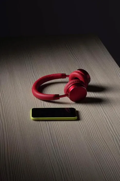 Framed Print : Headphones and smart phone on table Framed Print : Headphones and smart phone on table