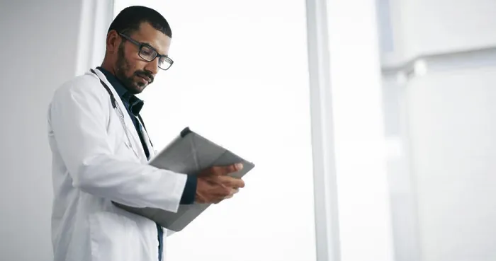 Framed Print : Healthcare, reading and doctor with tablet Framed Print : Healthcare, reading and doctor with tablet