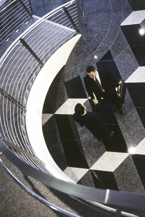 Framed Print : High angle view of two businessmen shaking hands Framed Print : High angle view of two businessmen shaking hands