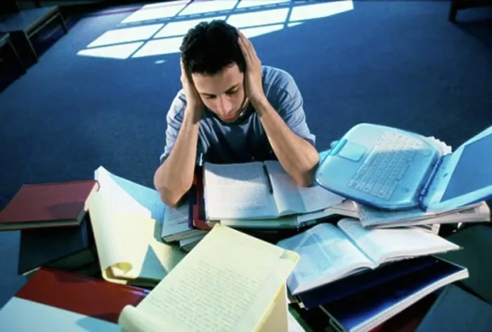 Framed Print : High angle view of a teenage boy studying Framed Print : High angle view of a teenage boy studying