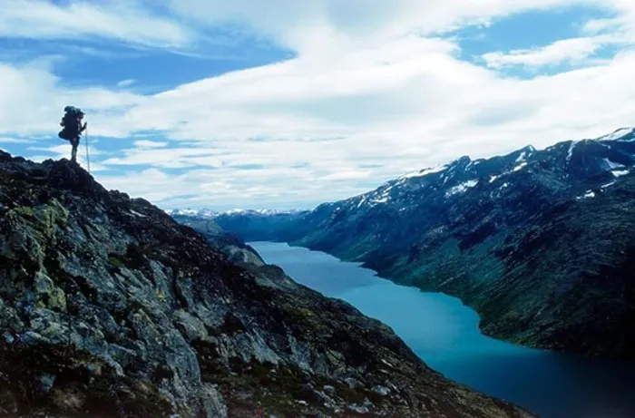 Framed Print : Hiker standing above Gjende (or Gjendin) Lake in the Jotunheimen mountains in Norway's Jotunheimen National Park Framed Print : Hiker standing above Gjende (or Gjendin) Lake in the Jotunheimen mountains in Norway's Jotunheimen National Park