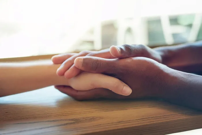 Framed Print : Holding hands, interracial and together for support Framed Print : Holding hands, interracial and together for support