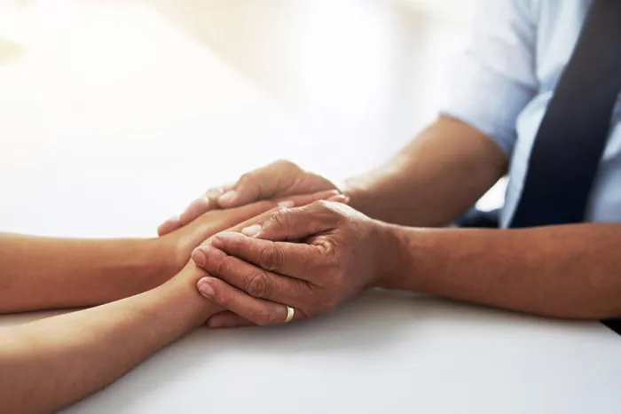 Framed Print : Holding hands, psychologist and patient for comfort