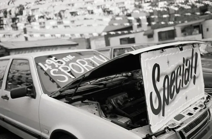 Framed Print : Hood of car open to display Special! at car dealership Framed Print : Hood of car open to display Special! at car dealership