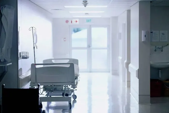 Framed Print : Empty hospital bed with intravenous drip in hospital ward