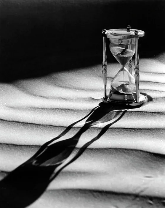 Framed Print : Hourglass with shadow on sand Framed Print : Hourglass with shadow on sand