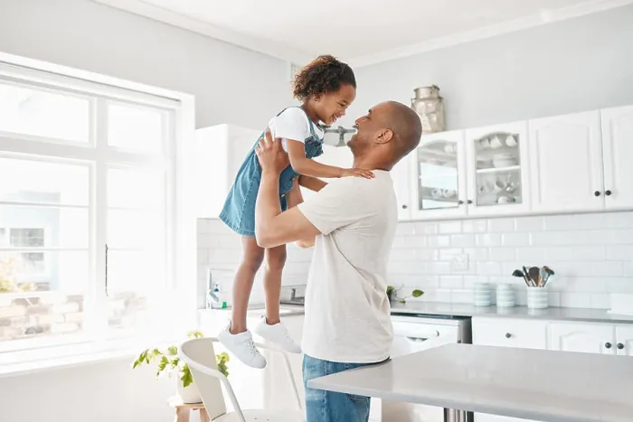 Framed Print : Hug, dad and girl in home for playing or bonding together and child care with single parent or love