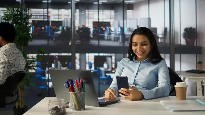 Framed Print : Indian employee engages in an online meeting with her team