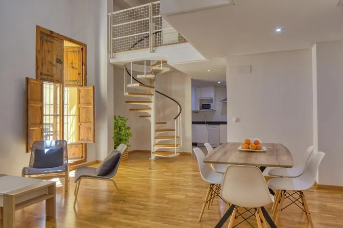 Framed Print : Interior of simple stylish dining room and stairs in modern duplex flat in daylight Framed Print : Interior of simple stylish dining room and stairs in modern duplex flat in daylight