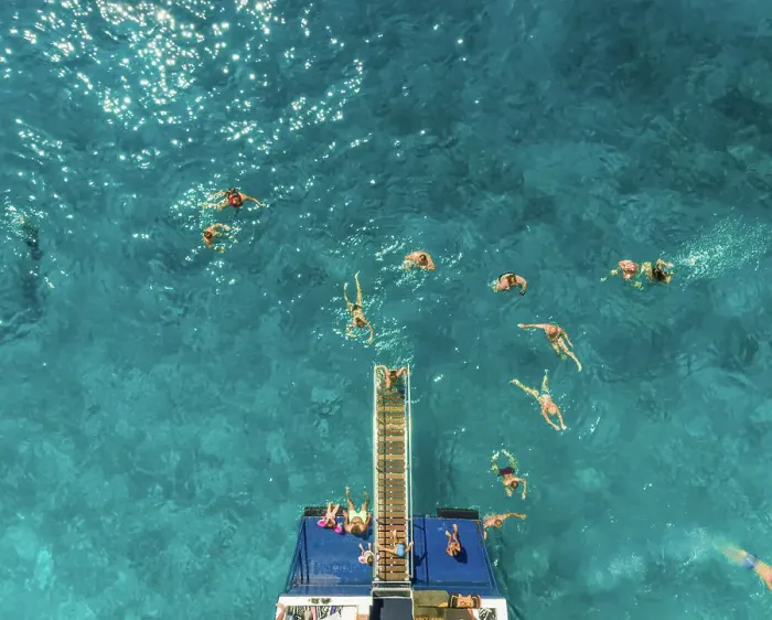 Framed Print : ITHAKI - GREECE, AUGUST 9 2018: Aerial view of people on ferry and swimming in sea, Ithaki island, Greece Framed Print : ITHAKI - GREECE, AUGUST 9 2018: Aerial view of people on ferry and swimming in sea, Ithaki island, Greece