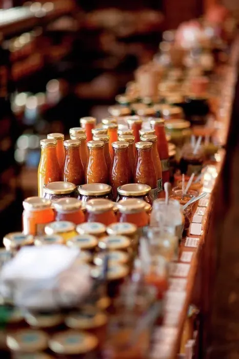 Framed Print : Jars of preserves and sauce in grocery Framed Print : Jars of preserves and sauce in grocery