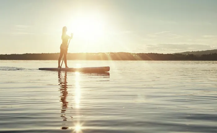 Framed Print : Lake, sunset and woman on paddle board to relax Framed Print : Lake, sunset and woman on paddle board to relax