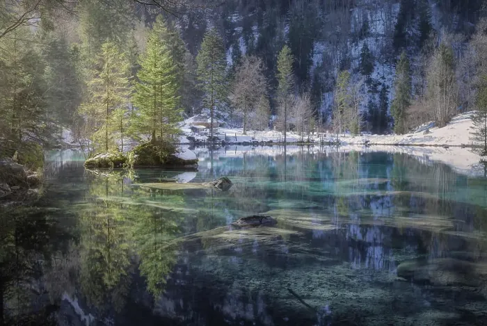 Framed Print : Landscape of peaceful azure lake with snowy shore in mountains of Switzerland Framed Print : Landscape of peaceful azure lake with snowy shore in mountains of Switzerland