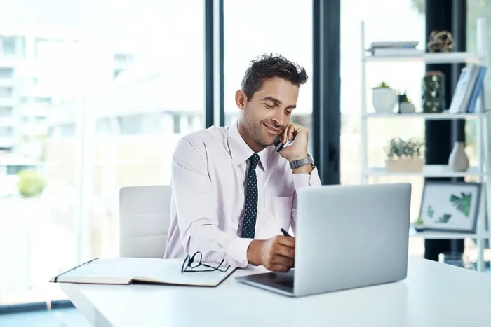 Framed Print : Laptop, phone call and writing with financial advisor man in office for communication or trading