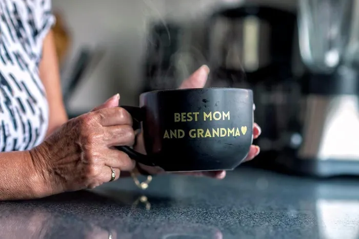 Framed Print : A latin grandma holding a black mug with a frase Framed Print : A latin grandma holding a black mug with a frase