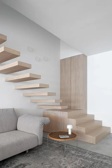 Framed Print : Living area with cantilevered stairs to the bedrooms