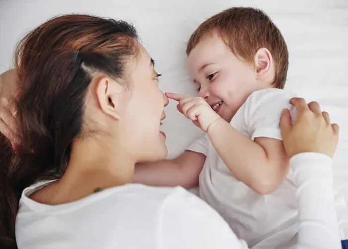 Framed Print : Love, mother and baby in bed from above