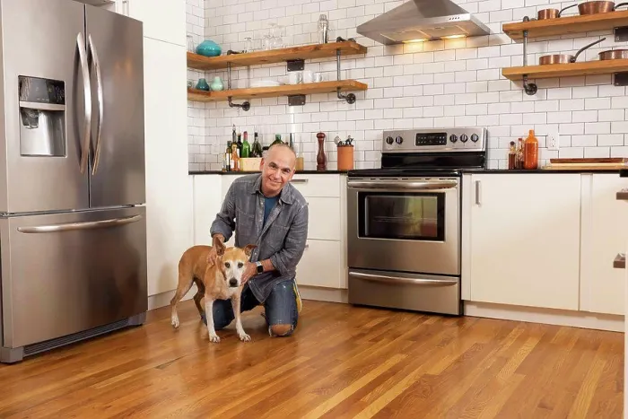 Framed Print : Low angle portrait of man and his pet together in kitchen
