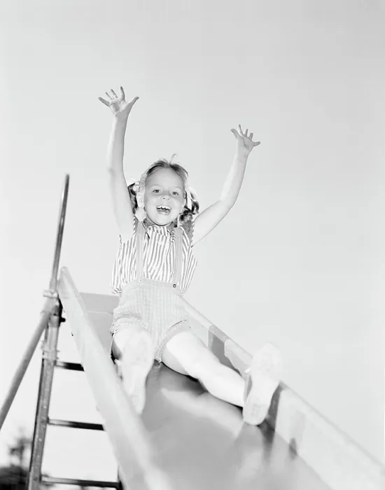 Framed Print : Low angle view of girl on slide Framed Print : Low angle view of girl on slide