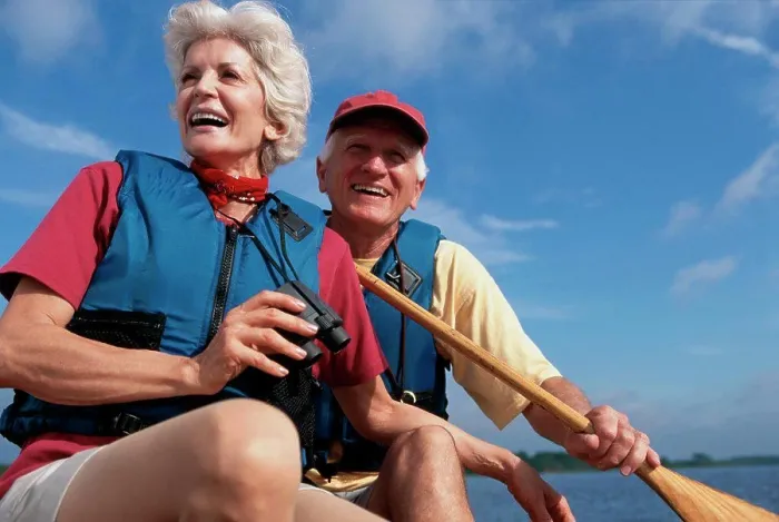 Framed Print : Low angle view of a senior couple in a row boat Framed Print : Low angle view of a senior couple in a row boat