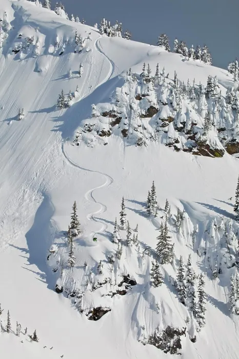 Framed Print : A male backcountry snowboarder sprays some powder in the Revelstoke Mountain Backcountry, BC