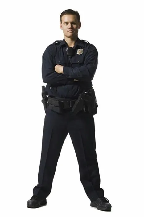 Framed Print : Male police officer standing with arms crossed