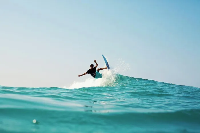 Framed Print : Male surfer riding turquoise blue ocean wave