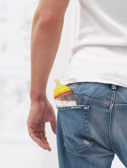 Framed Print : Man with a babies bottle in pocket