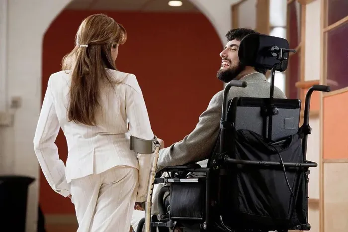Framed Print : Man with Cerebral Palsy and woman with cane conversing Framed Print : Man with Cerebral Palsy and woman with cane conversing