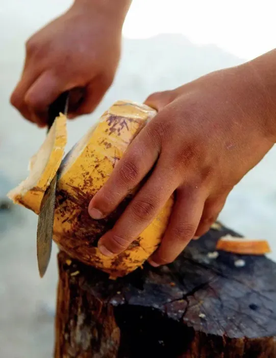 Framed Print : Man cutting coconut Framed Print : Man cutting coconut