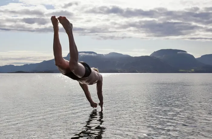 Framed Print : Man diving into water, Aure, Norway