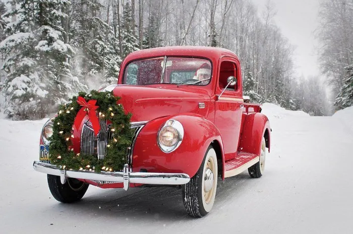 Framed Print : Man driving a vintage 1941 Ford pickup with a Christmas wreath on the front during Winter in Southcentral, Alaska
