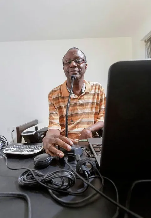 Framed Print : Man with Guillain-Barre Syndrome using his technical equipment at home office Framed Print : Man with Guillain-Barre Syndrome using his technical equipment at home office
