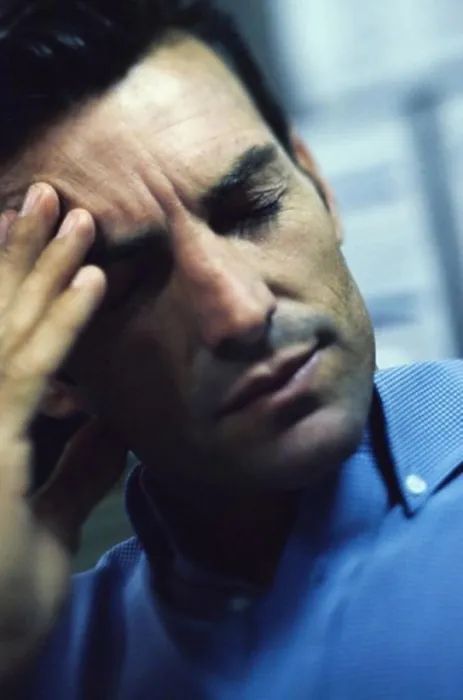 Framed Print : Man holding his forehead in pain Framed Print : Man holding his forehead in pain