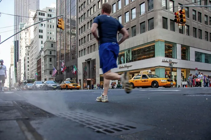 Framed Print : Man jogging on busy New York street from behind Framed Print : Man jogging on busy New York street from behind