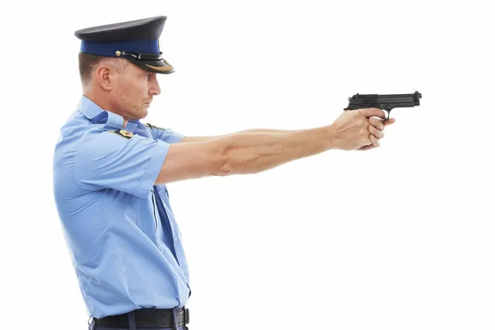 Framed Print : Man, police officer and pointing gun ready to fire or shoot standing isolated on a white studio background Framed Print : Man, police officer and pointing gun ready to fire or shoot standing isolated on a white studio background
