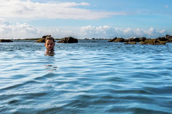 Framed Print : A man relaxing in a tidal pool on the south coast of the Big Island of Hawaii (MR) Framed Print : A man relaxing in a tidal pool on the south coast of the Big Island of Hawaii (MR)