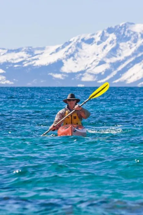 Framed Print : A man sea kayaking on Lake Tahoe near Incline Village in Nevada Framed Print : A man sea kayaking on Lake Tahoe near Incline Village in Nevada