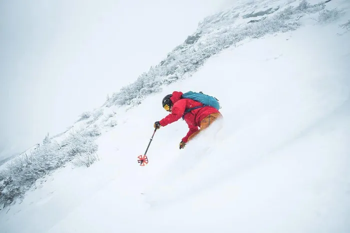 Framed Print : Man skiing in deep snow in the alpine during a snowstorm in Maine Framed Print : Man skiing in deep snow in the alpine during a snowstorm in Maine