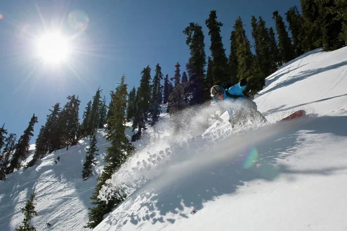 Framed Print : A man snowboards the Mount Axtel backcountry on a sunny Colorado day