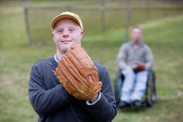 Framed Print : Man with Down Syndrome wearing a baseball glove Framed Print : Man with Down Syndrome wearing a baseball glove
