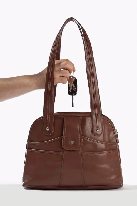 Framed Print : Detail of a man taking keys out of a handbag Framed Print : Detail of a man taking keys out of a handbag