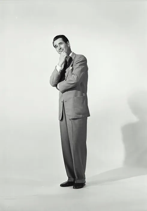 Framed Print : Man in zoot suit on white background with hand on chin