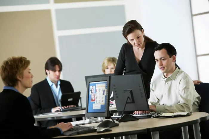 Framed Print : Manager going over business plan with staff Framed Print : Manager going over business plan with staff