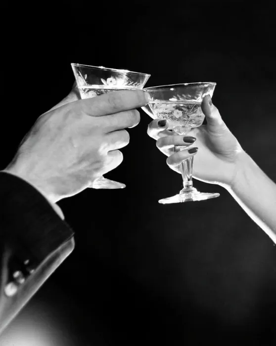 Framed Print : Man's hand and woman's hand toasting with Martini Framed Print : Man's hand and woman's hand toasting with Martini